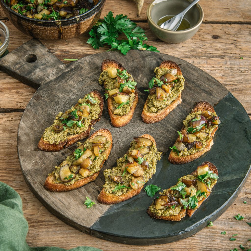 Vegan Basil Pesto Crostini with aubergines, caper & parsley