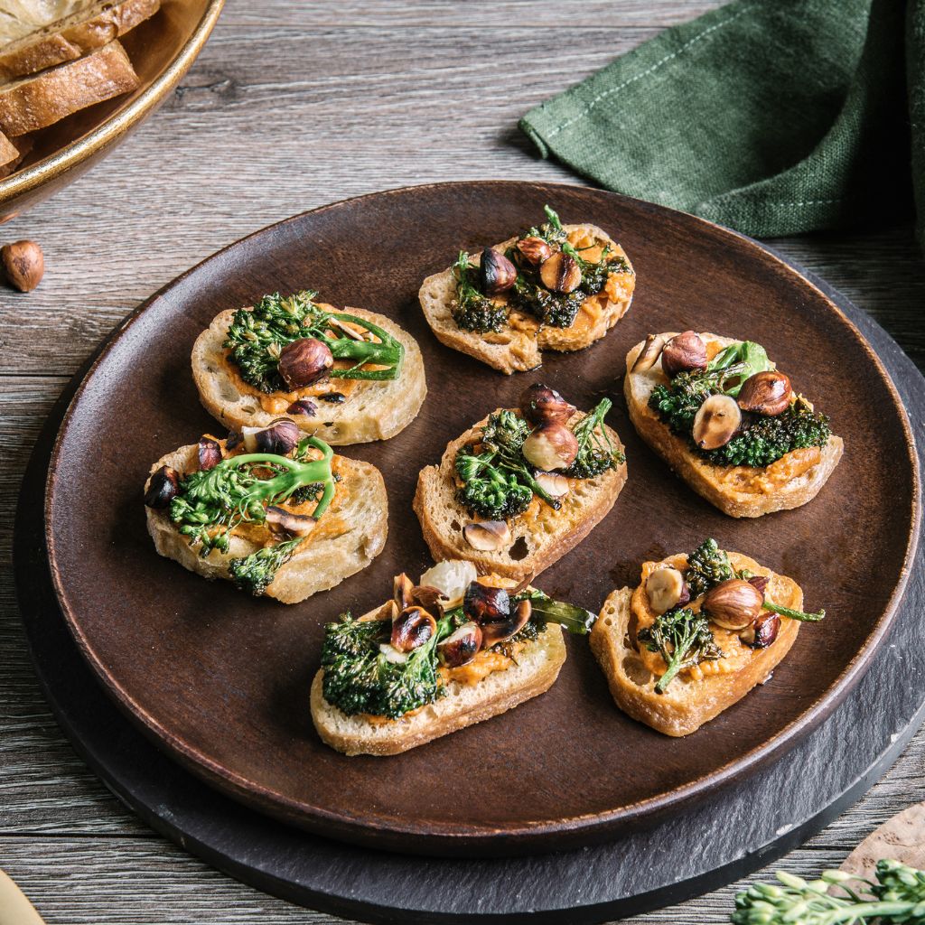 Tomato & Ricotta crostini with charred broccolini & hazelnuts